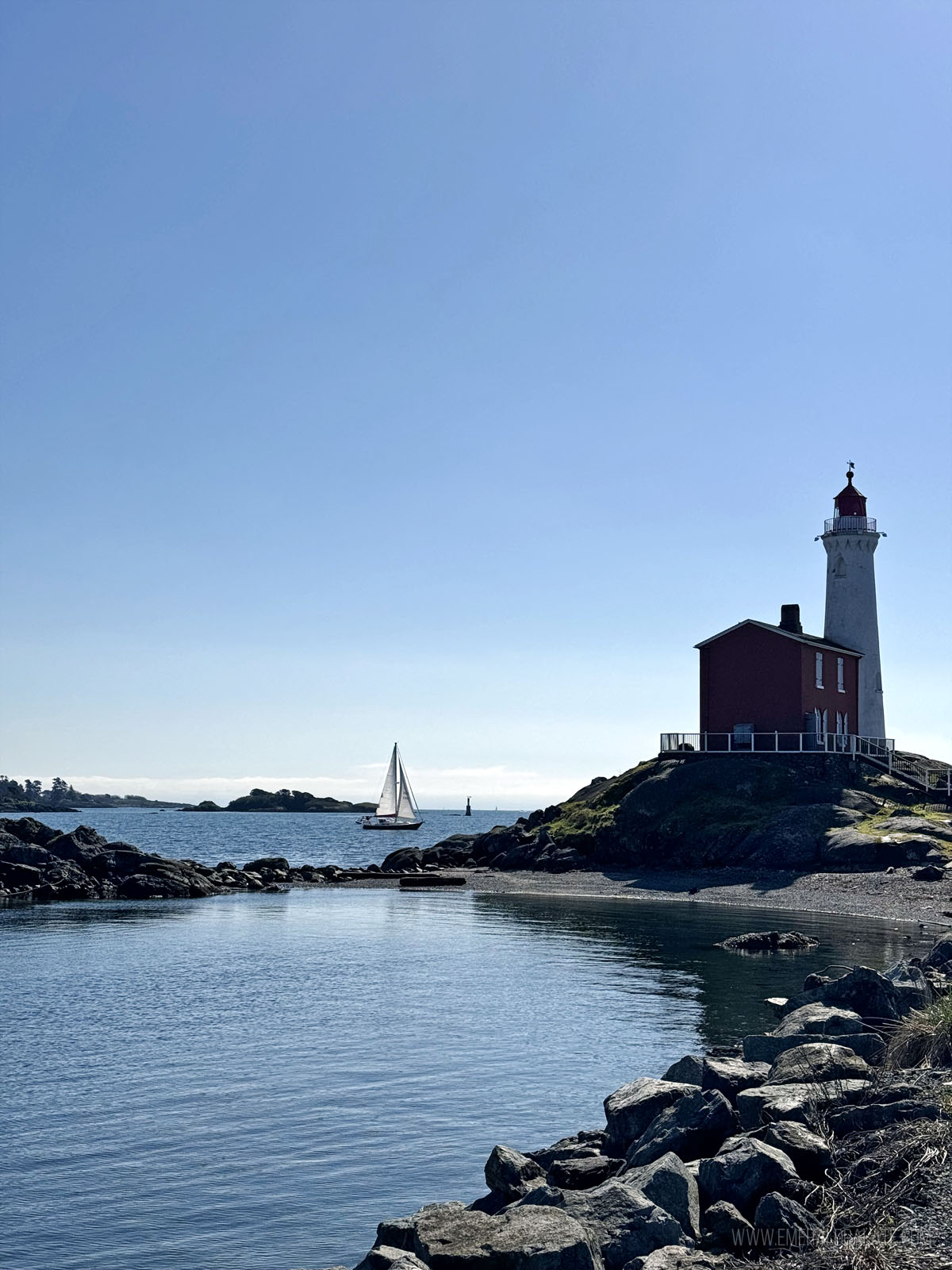 lighthouse and sailboat