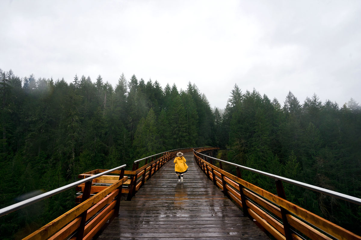 woman running on a trestle that's one of the most unique things to do in Victoria BC