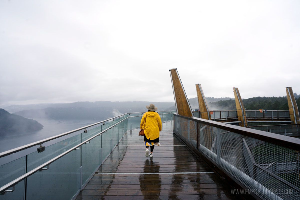 woman walking along Malahat Skywalk, one of the most unique things to do in Victoria BC
