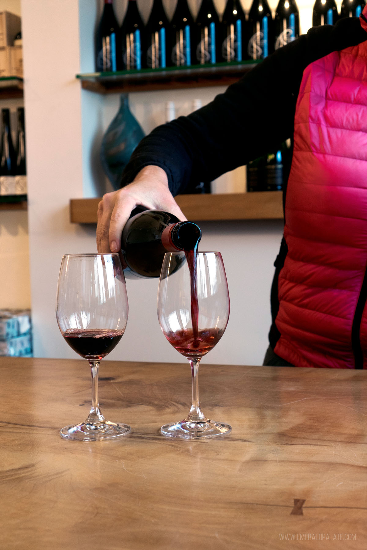 woman pouring wine at a Cowichan Valley winery