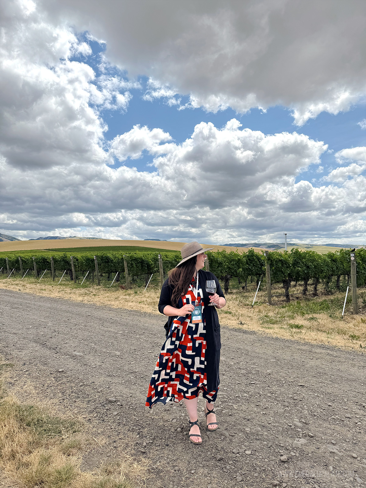 woman walking through the vineyards in Walla Walla