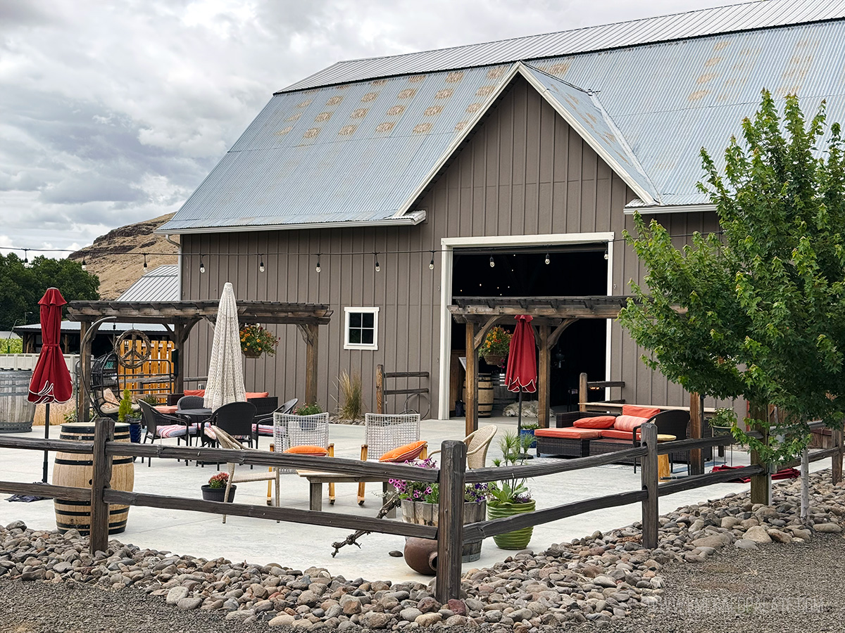 barn restored into a wine tasting room with a large outdoor patio