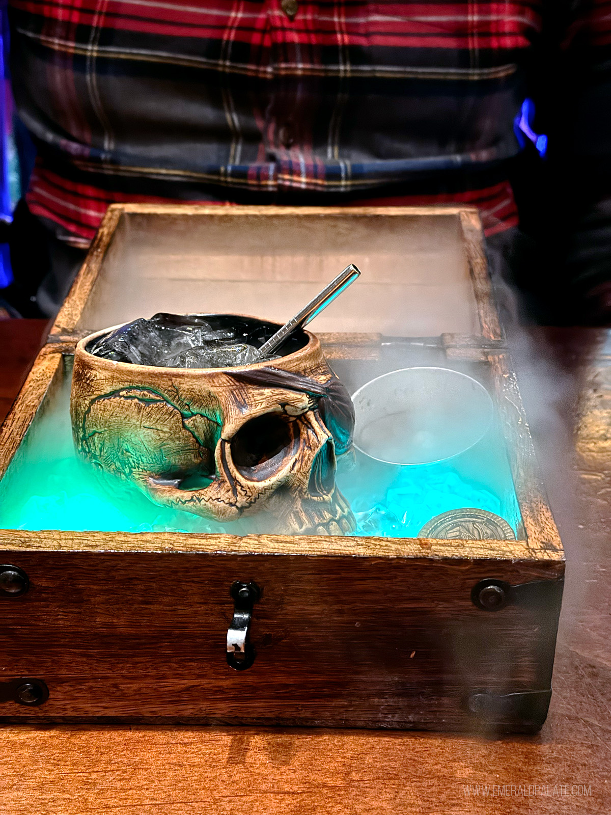 smoking cocktail in a skull cup