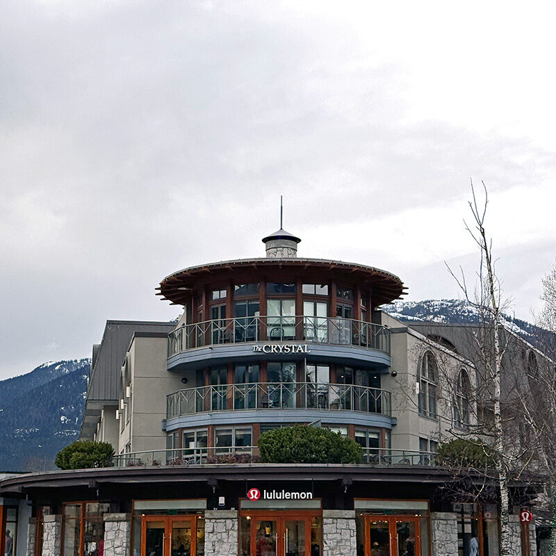 hotel in Whistler Village with mountains in the background, one of the best hotels in Whistler