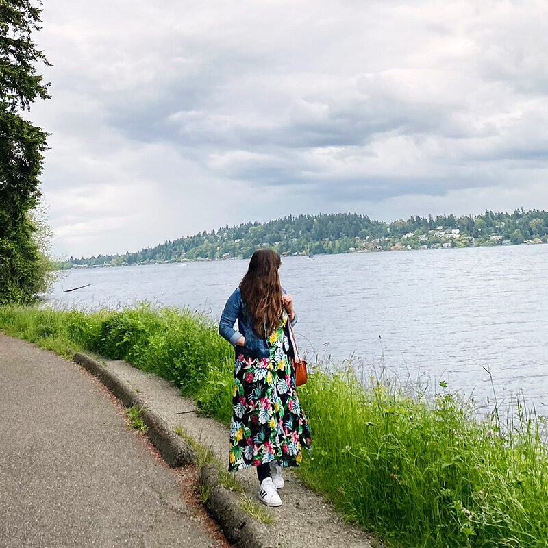 Woman walking along the water, one of the best things to do in Seattle in May