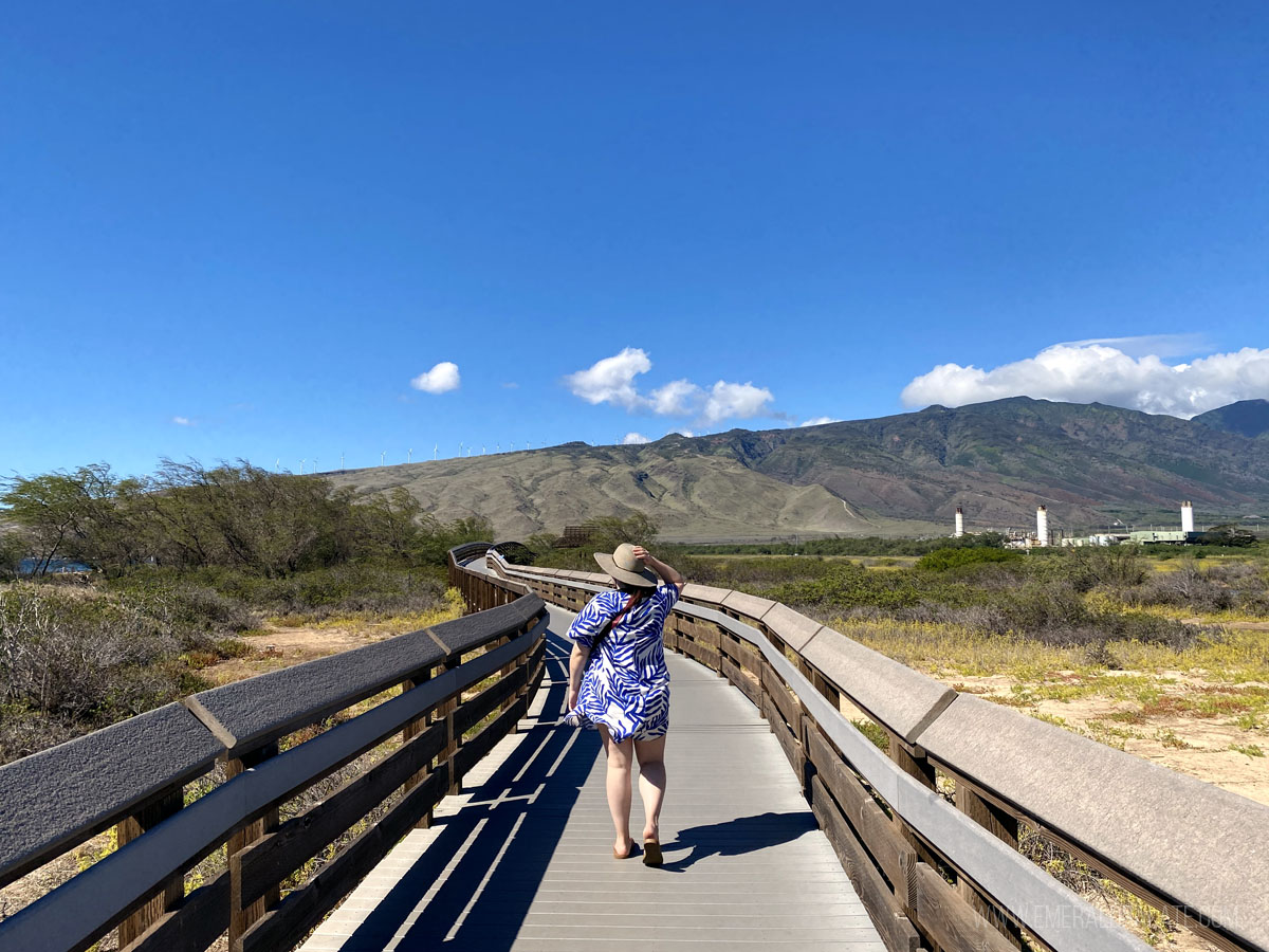 woman walking along the boardwalk at Keila Pond, one of the best things to do in Maui Hawaii
