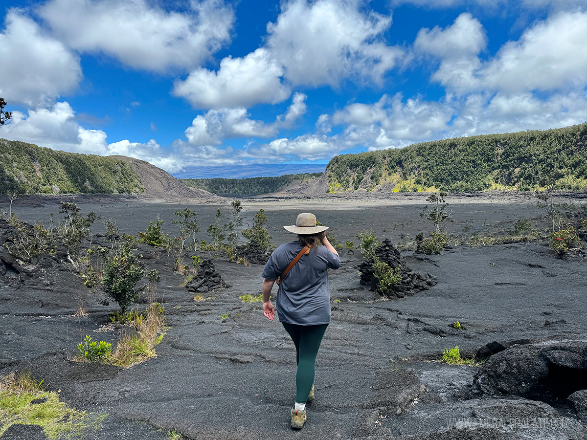 person walking in the caldera on the Kilauea Ike Trail in Volcanoes National Park, one of the best things to do on the Big Island in Hawaii