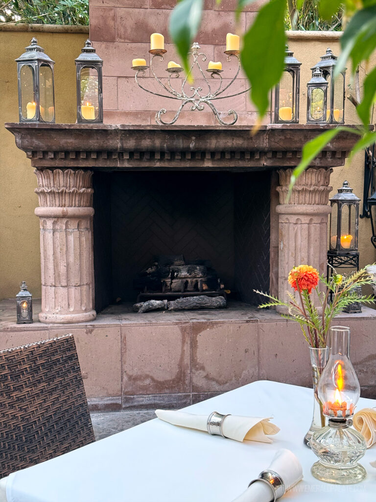 Elegant stone fireplace on an outdoor patio at a Scottsdale restaurant