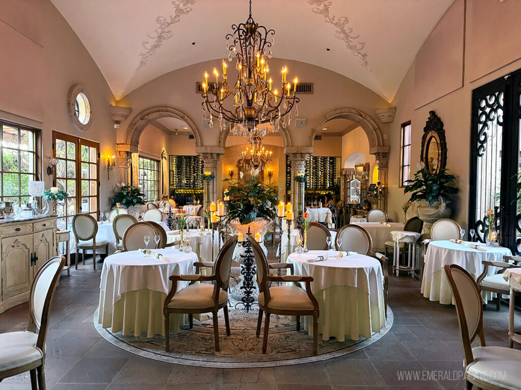 inside a beautiful, elegant Scottsdale restaurant with chandeliers, crown molding, and candles