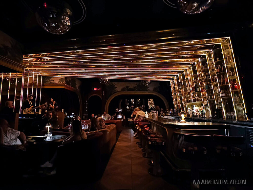 inside a speakeasy bar with a huge geometric light installation giving it art deco vibes, one of the best things to do in Scottsdale, Arizona