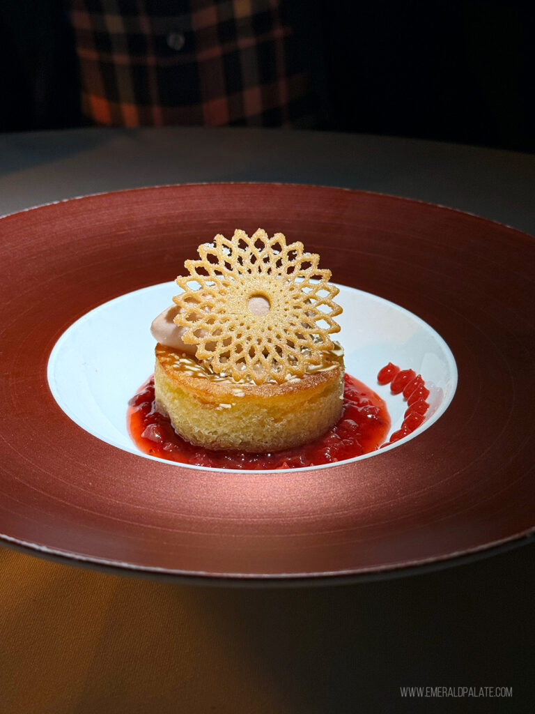 fancy dessert with a lattice cookie on top of a cake