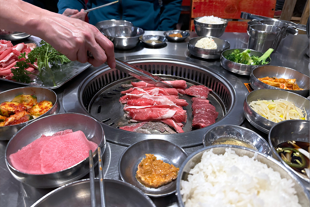 person grilling meets on a tabletop grill at Korean BBQ in Seattle, WA