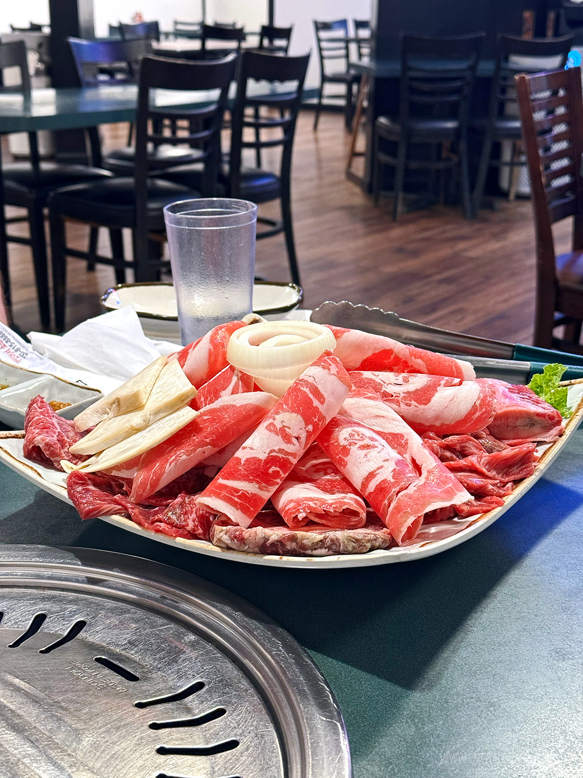 plate of raw meat ready for grilling