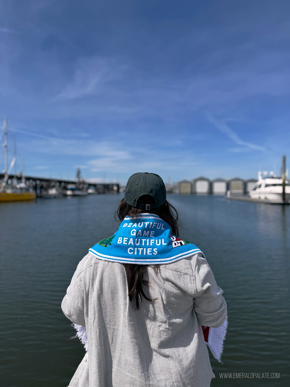 woman wearing FIFA scarf overlooking Everett waterfront