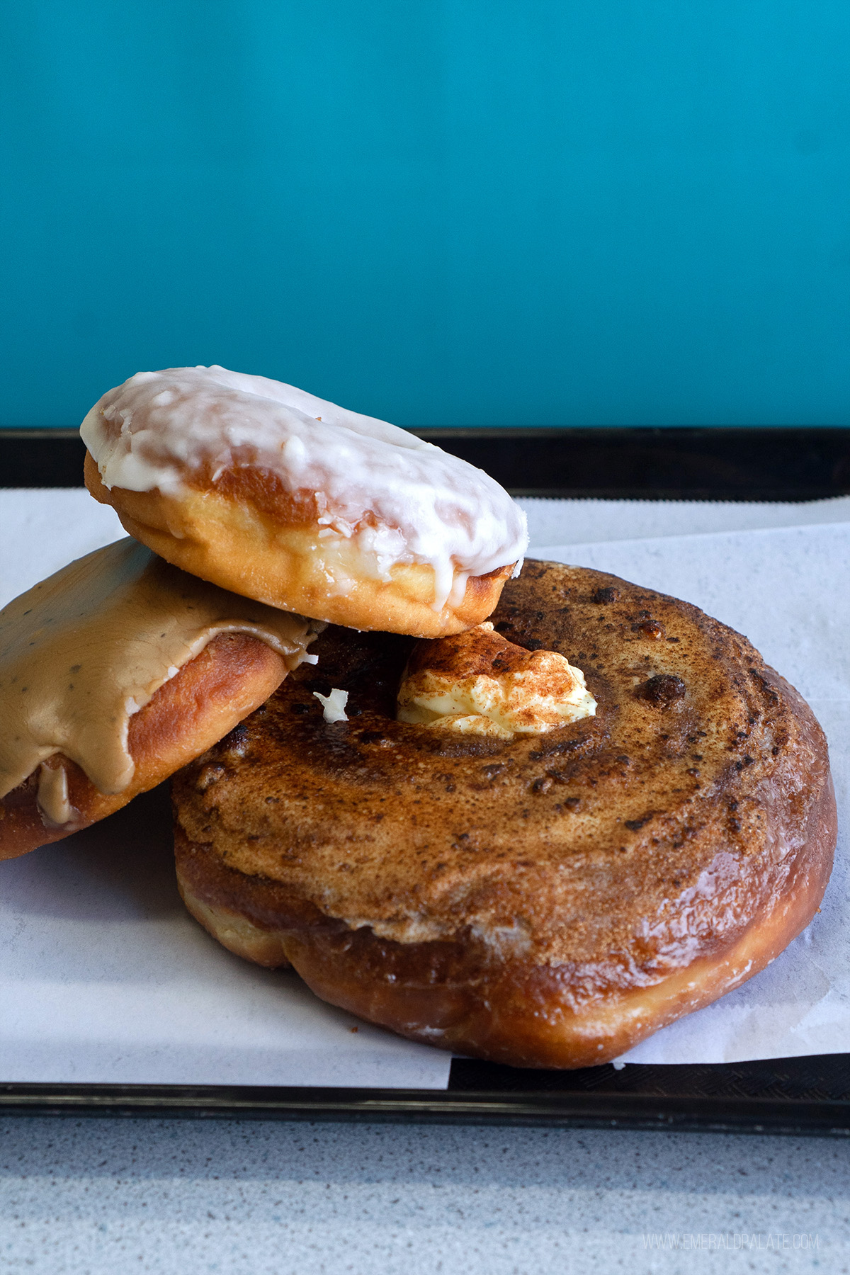Three stacked donuts from one of the best restaurants in Lynnwood