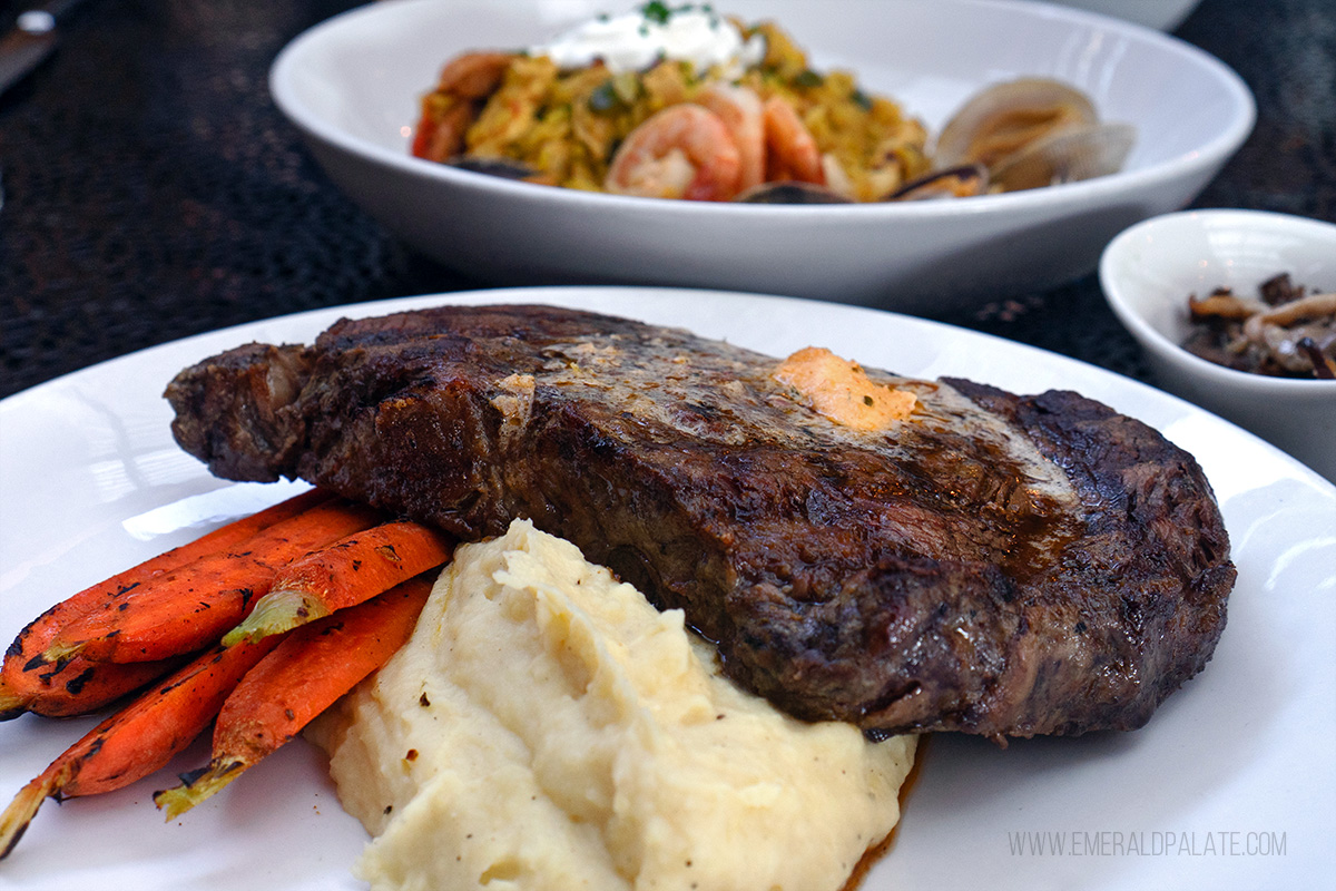 Steak over potatoes and carrots from a restaurant in Lake Stevens