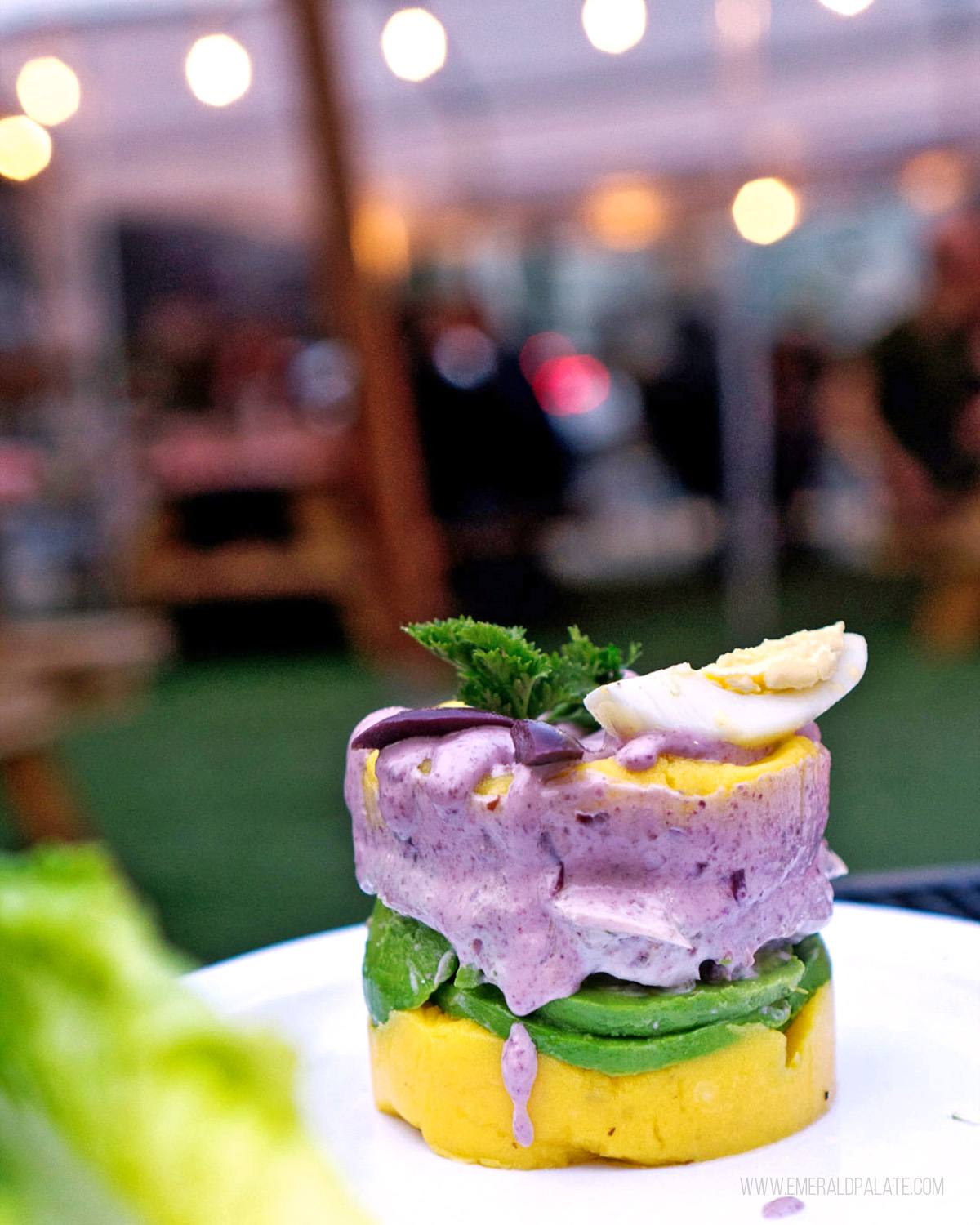 stack of potato salad with patio in background from one of the best pet-friendly restaurants in Seattle