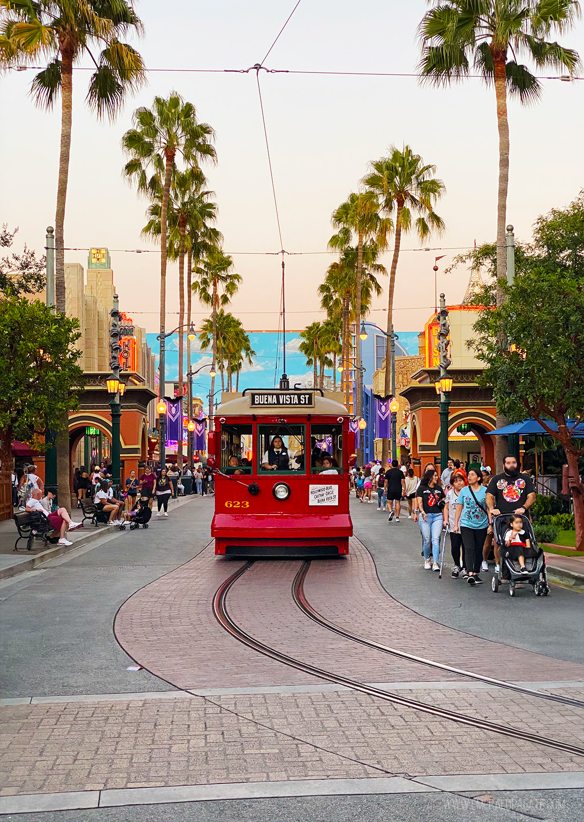 Trolly riding along tracks at Disneyland California Adventure at Golden Hour