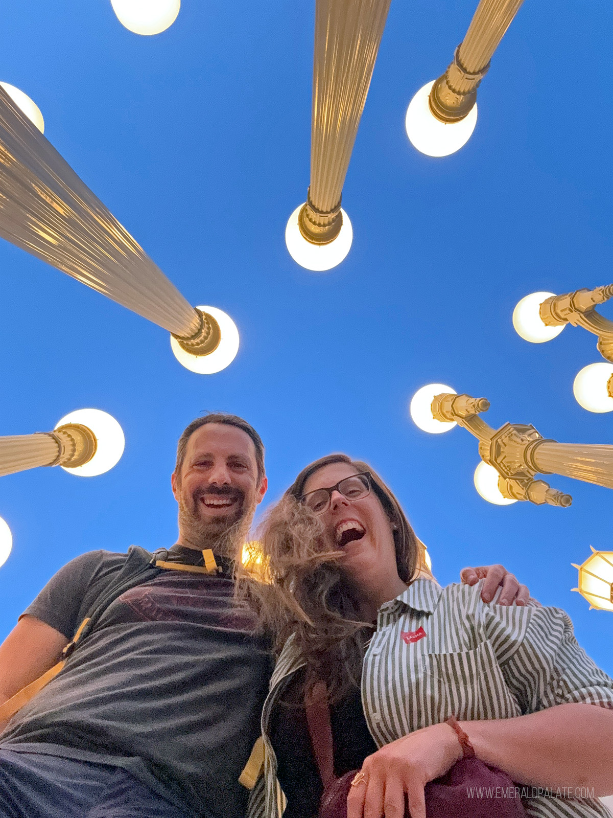 couple laughing for a pic in an art installation in LA