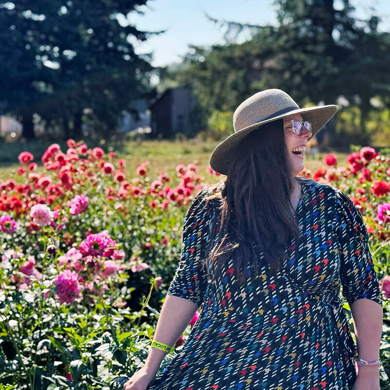 woman frolicking in a flower field, one of the best things to do in Blaine, WA